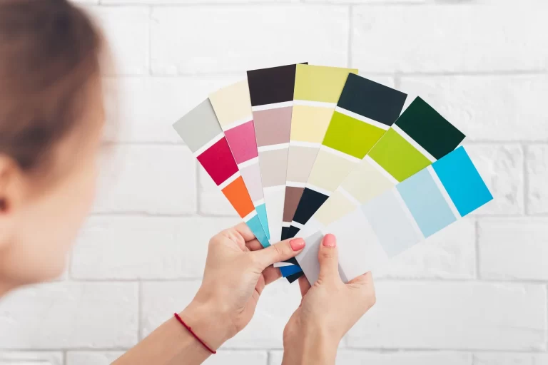 Close up of female with color pallets choosing color